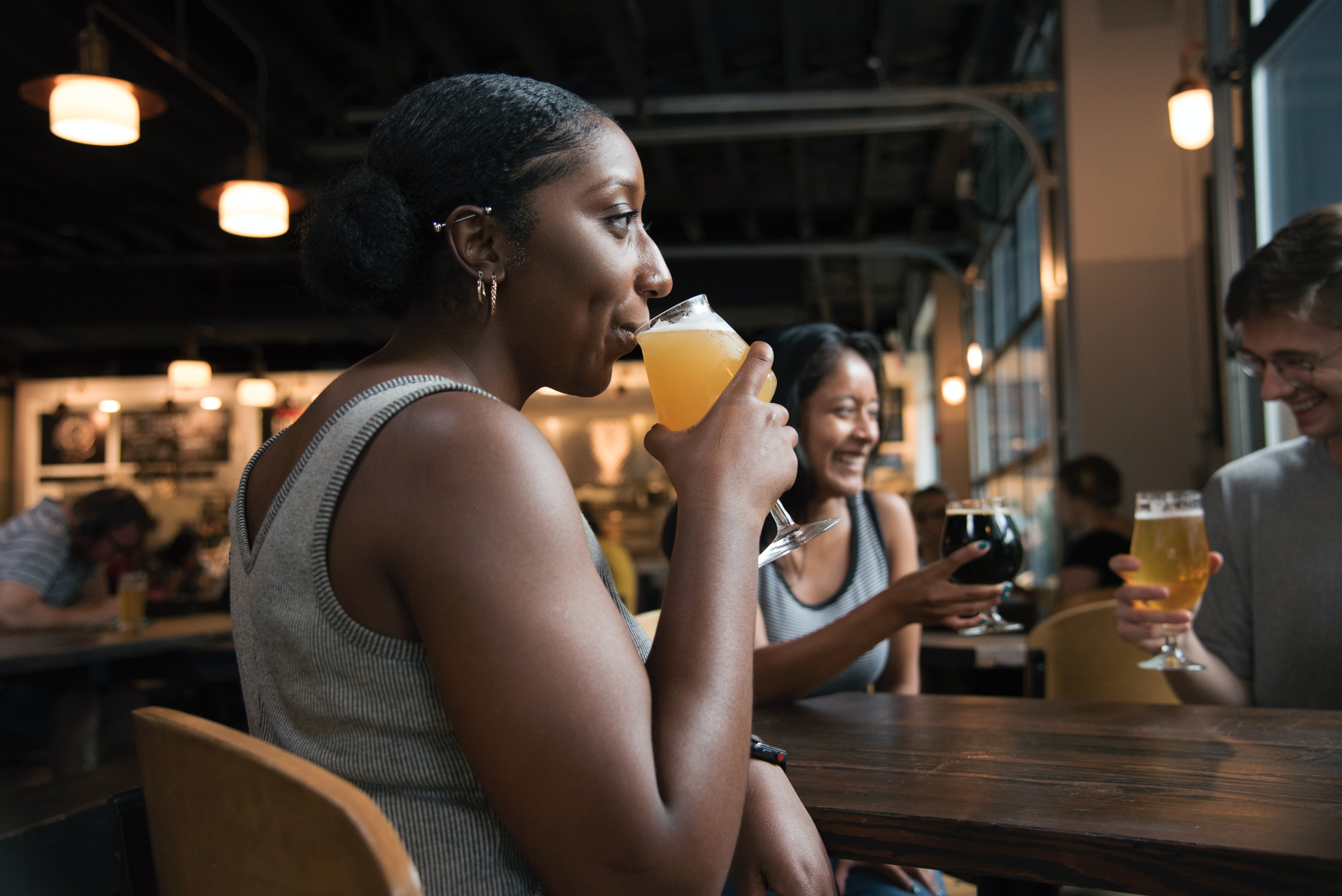 Woman drinking at a bar