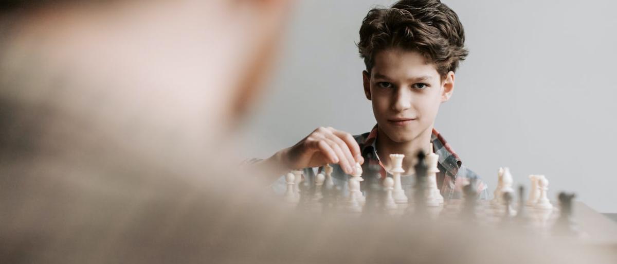 A boy playing chess