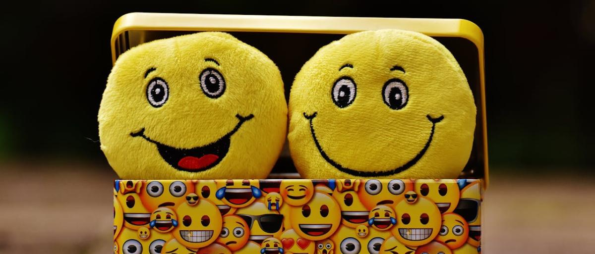 Smiling emojis in a box