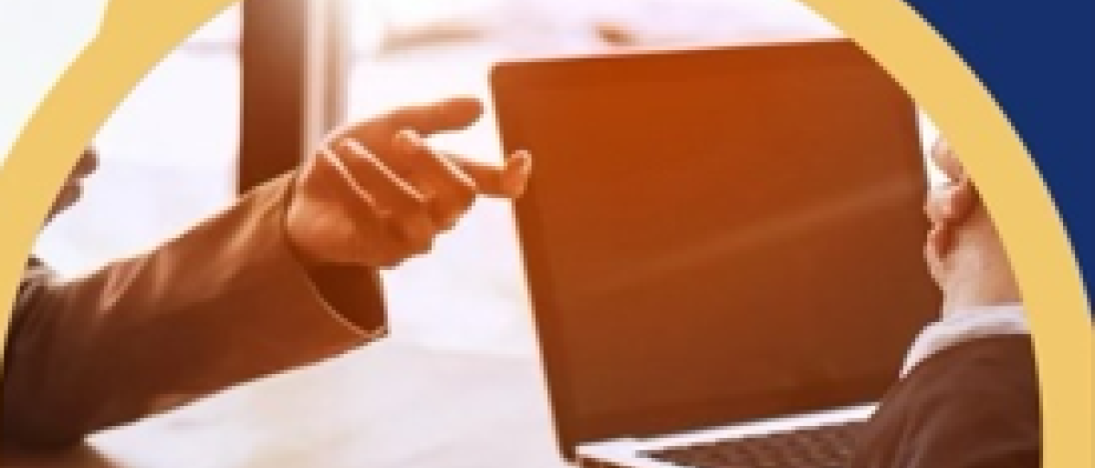 Someone pointing a finger at a laptop