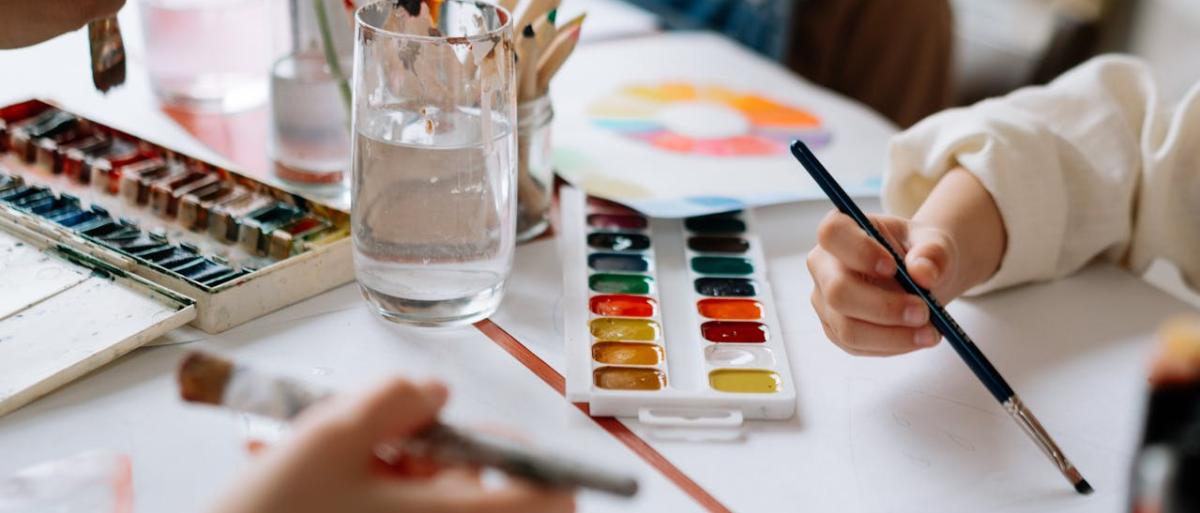 Kids holding painting brush