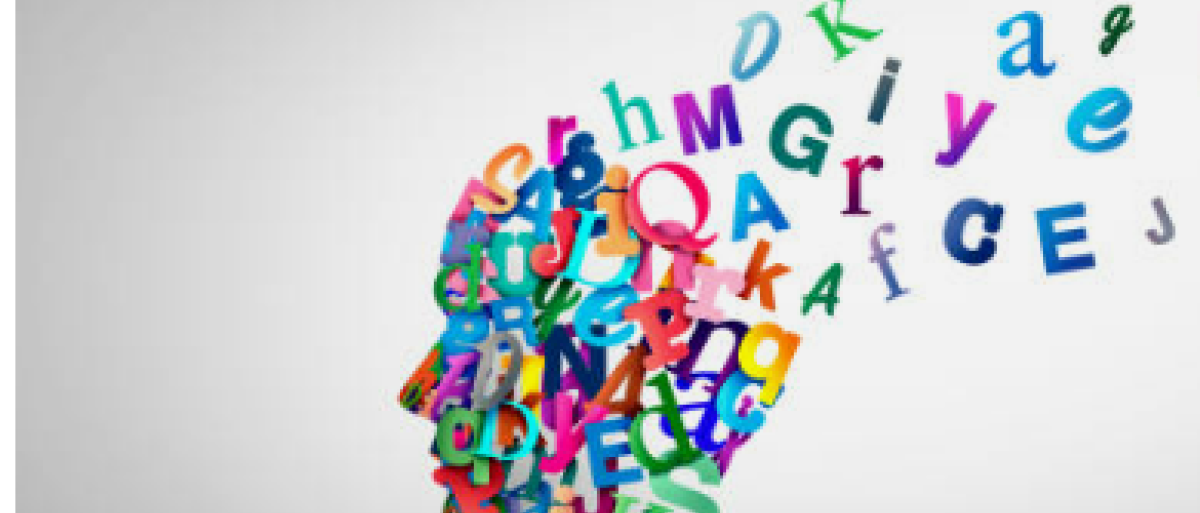 A picture of a head made with letters floating around