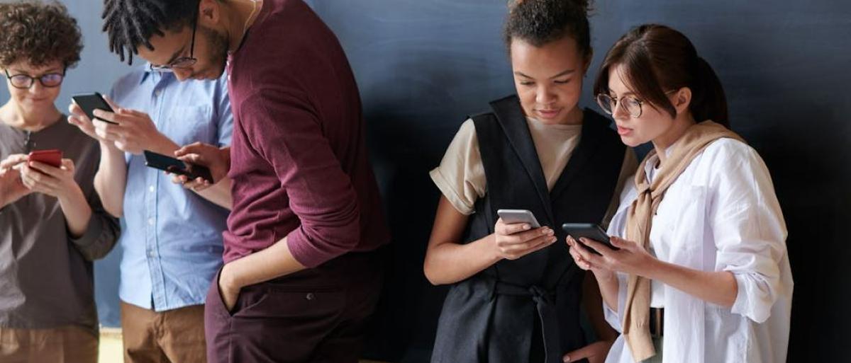 Young people using phones.JPG