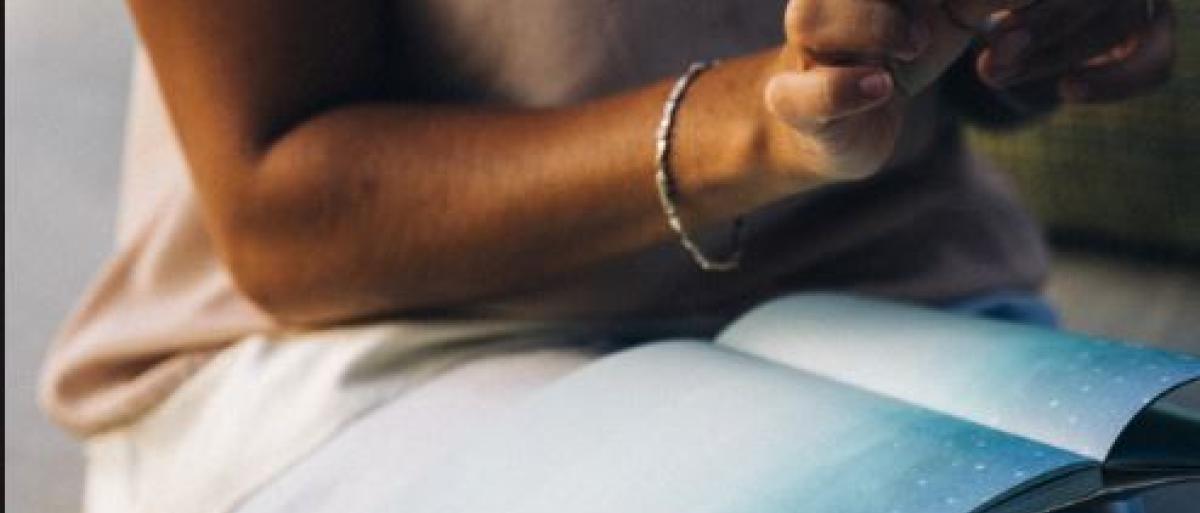 A woman writing into a book