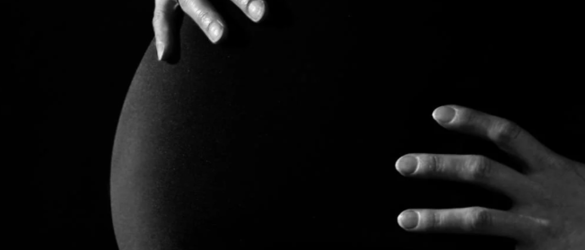 A pregnant woman with a  baby bump