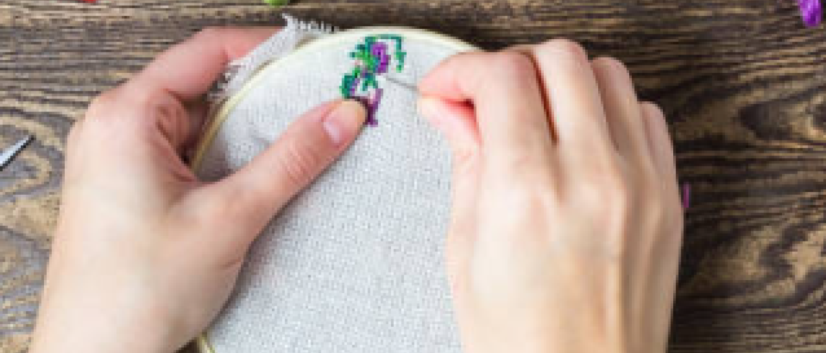 Someone doing embroidery stiches