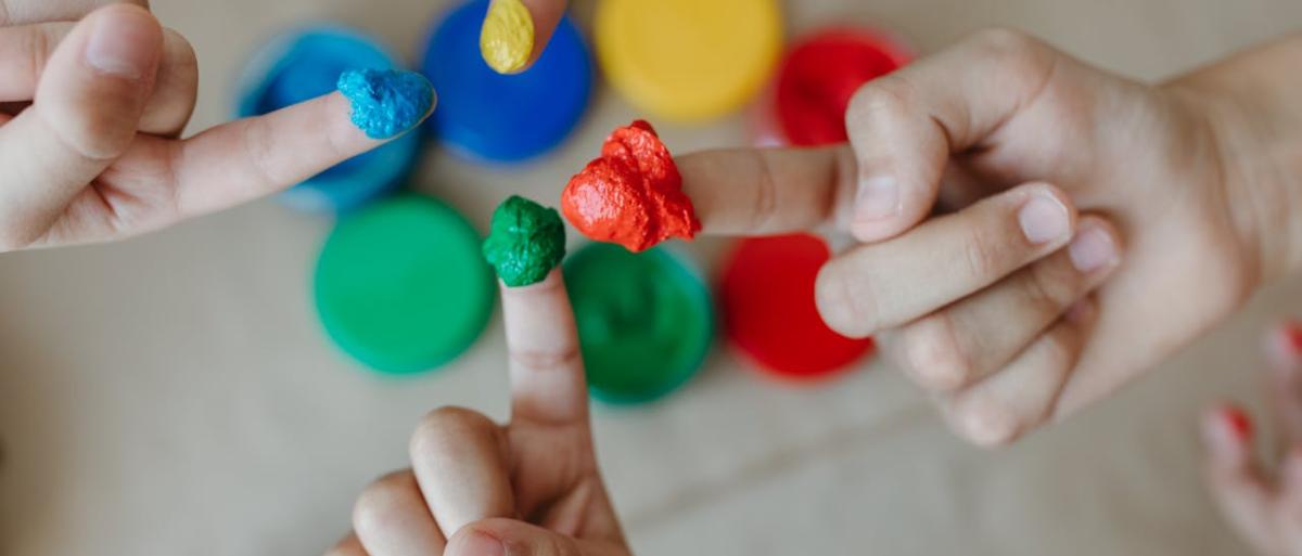 Children with paints on their fingers