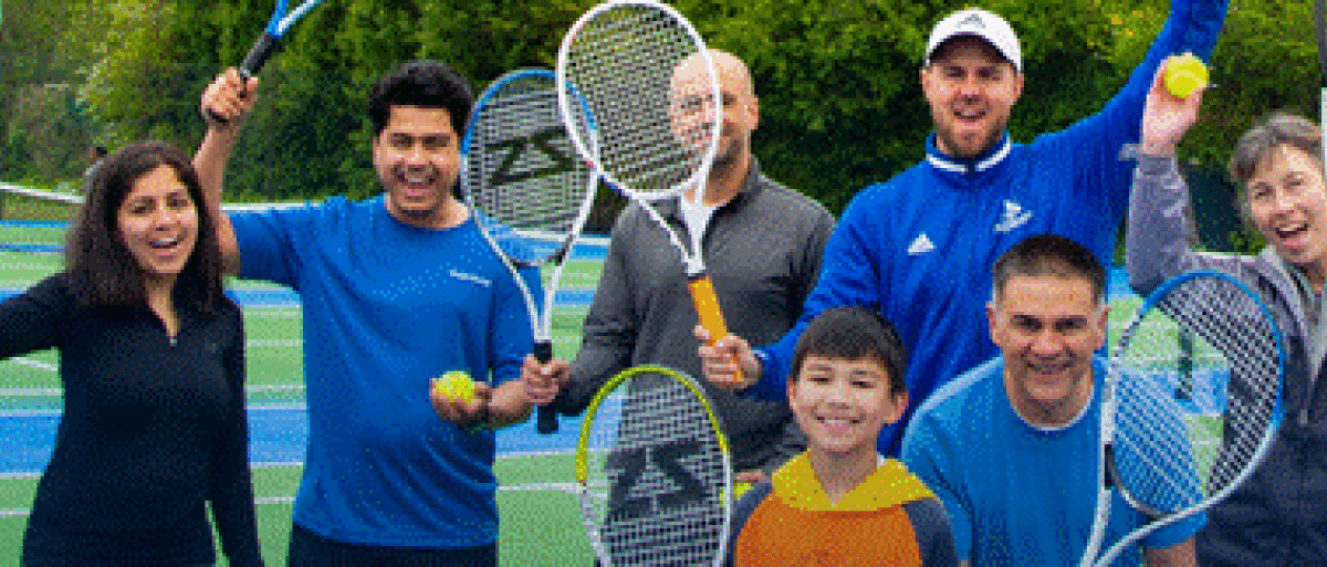 A group of people holding rackets
