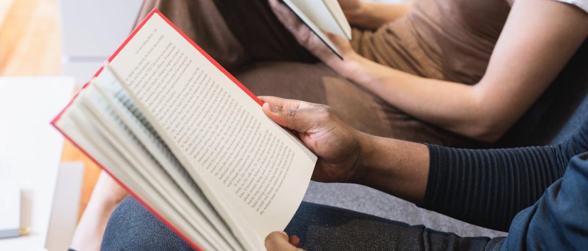 People holding and reading books