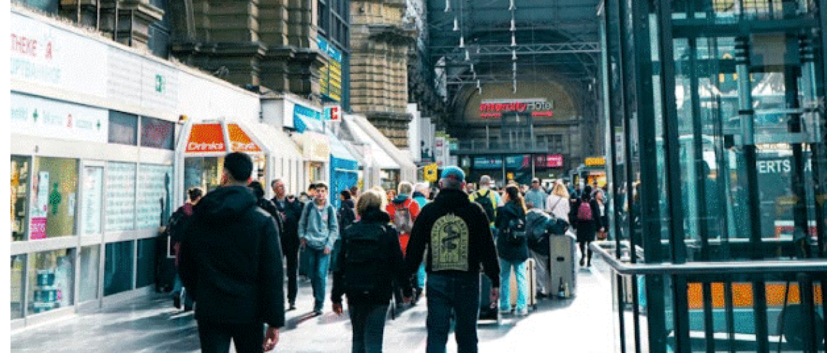 People walking at a train station