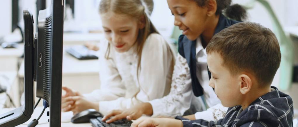 Children playing with the computer