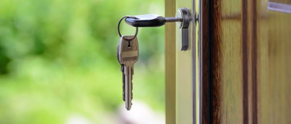Key in the frontdoor of a property