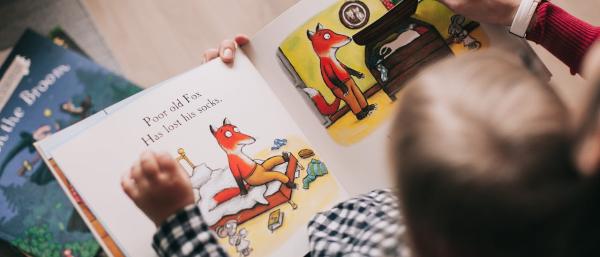 A baby reading a book 