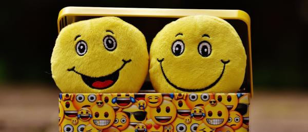 Smiling emojis in a box