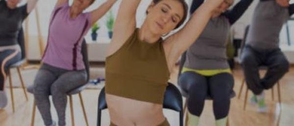 People doing chair based yoga