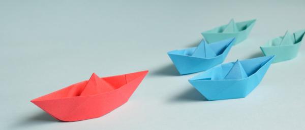 Paper boats in colour pink and blue