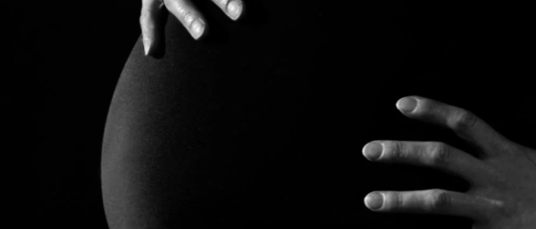 A pregnant woman with a  baby bump