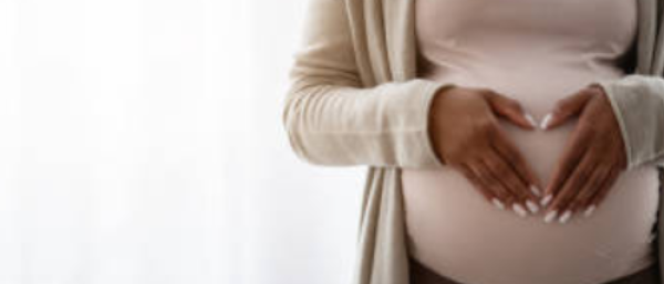 A pregnant woman with a  baby bump 