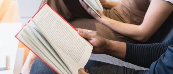 People holding and reading books