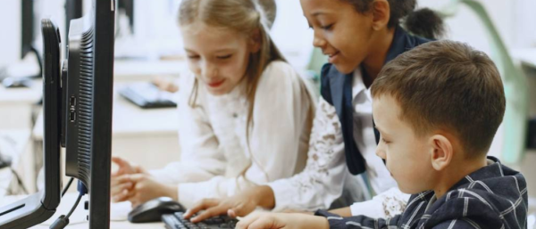 Children playing with the computer