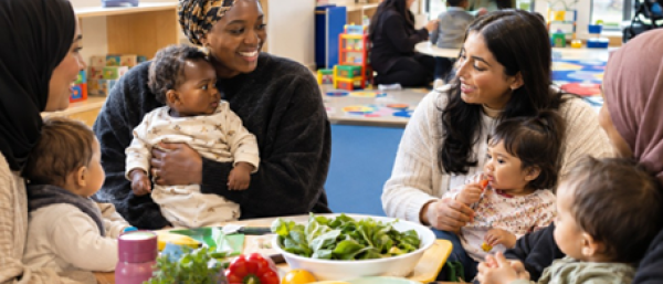 New mums at their babies cooking healthy food