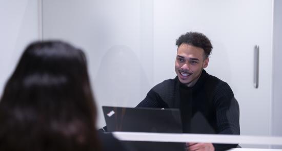 Man speaking to a woman offering help