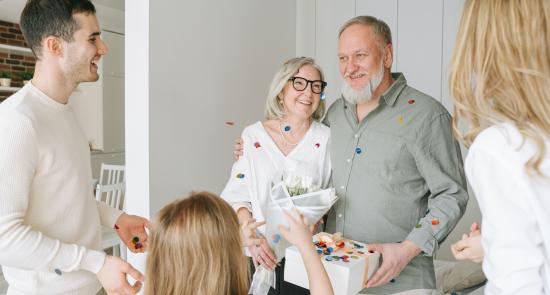 Older parents having a birthday celebration with their family