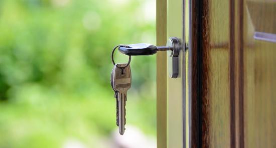 Key in the frontdoor of a property