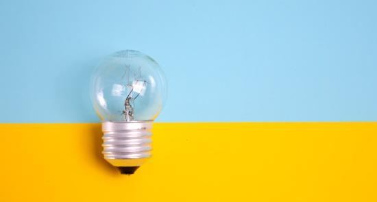 Lightbulb on a blue and yellow background