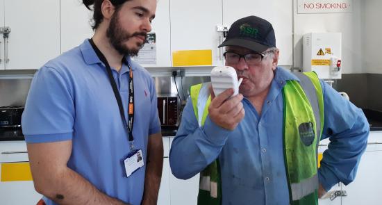Man doing a breath test as part of a Stoptober event