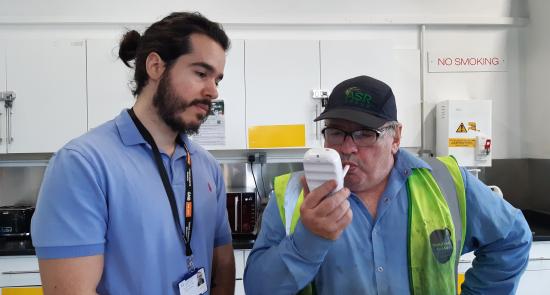 Man doing a breath test as part of a Stoptober event