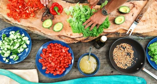 People chopping fruit and vegetables