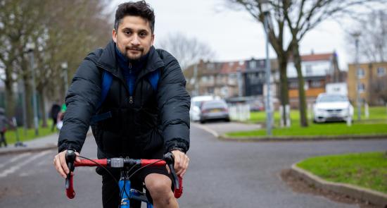 A man cycling and keeping active