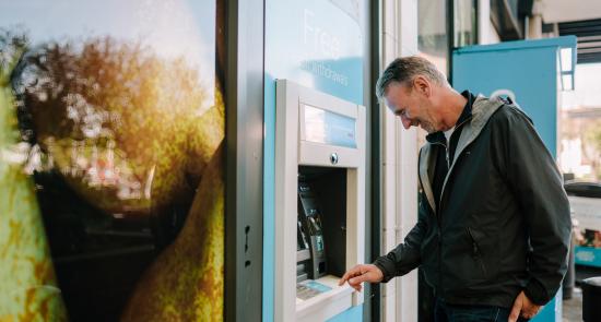 Man getting money out of an ATM