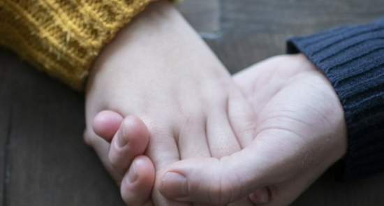 2 hands holding each other