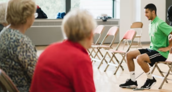Elderly people watching a coach