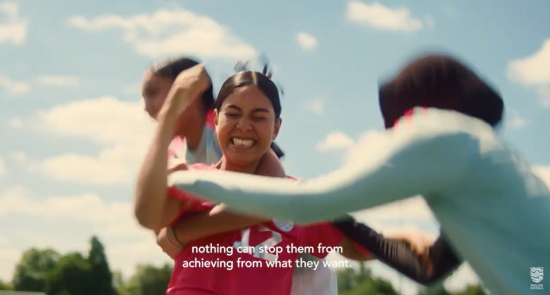 Girls playing football